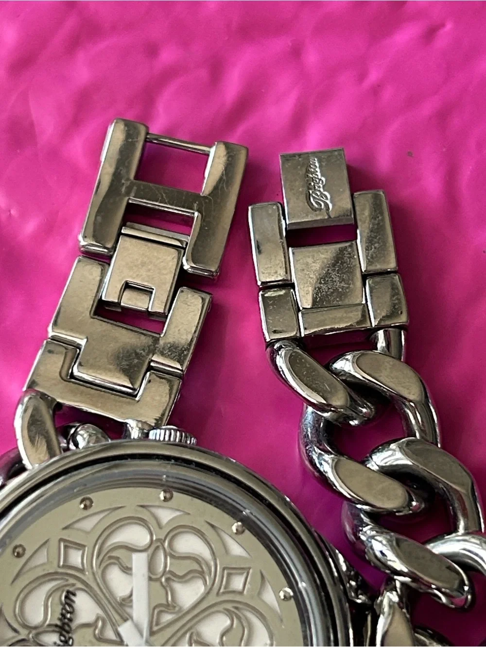 Brighton chain-link watch showcasing the ornate, scrollwork cut-out motif